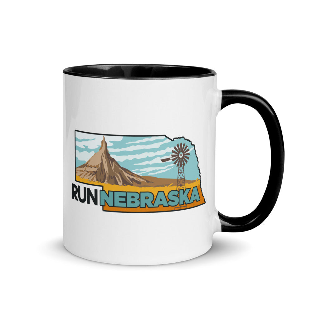 Nebraska running mug with black handle and inside rim