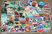 Collection of various state-themed stickers on a brown background